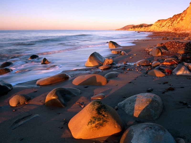 sunrise colors the bluffs of the beach gaviota